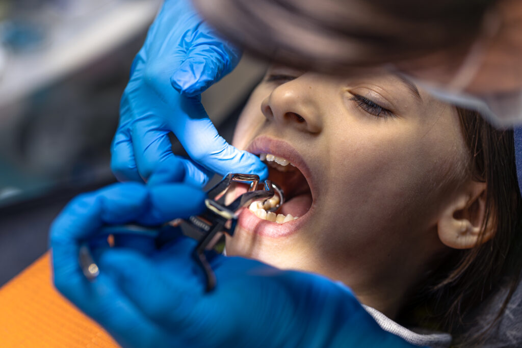 girl dentists office dentist examining child patients teeth dentistry concept